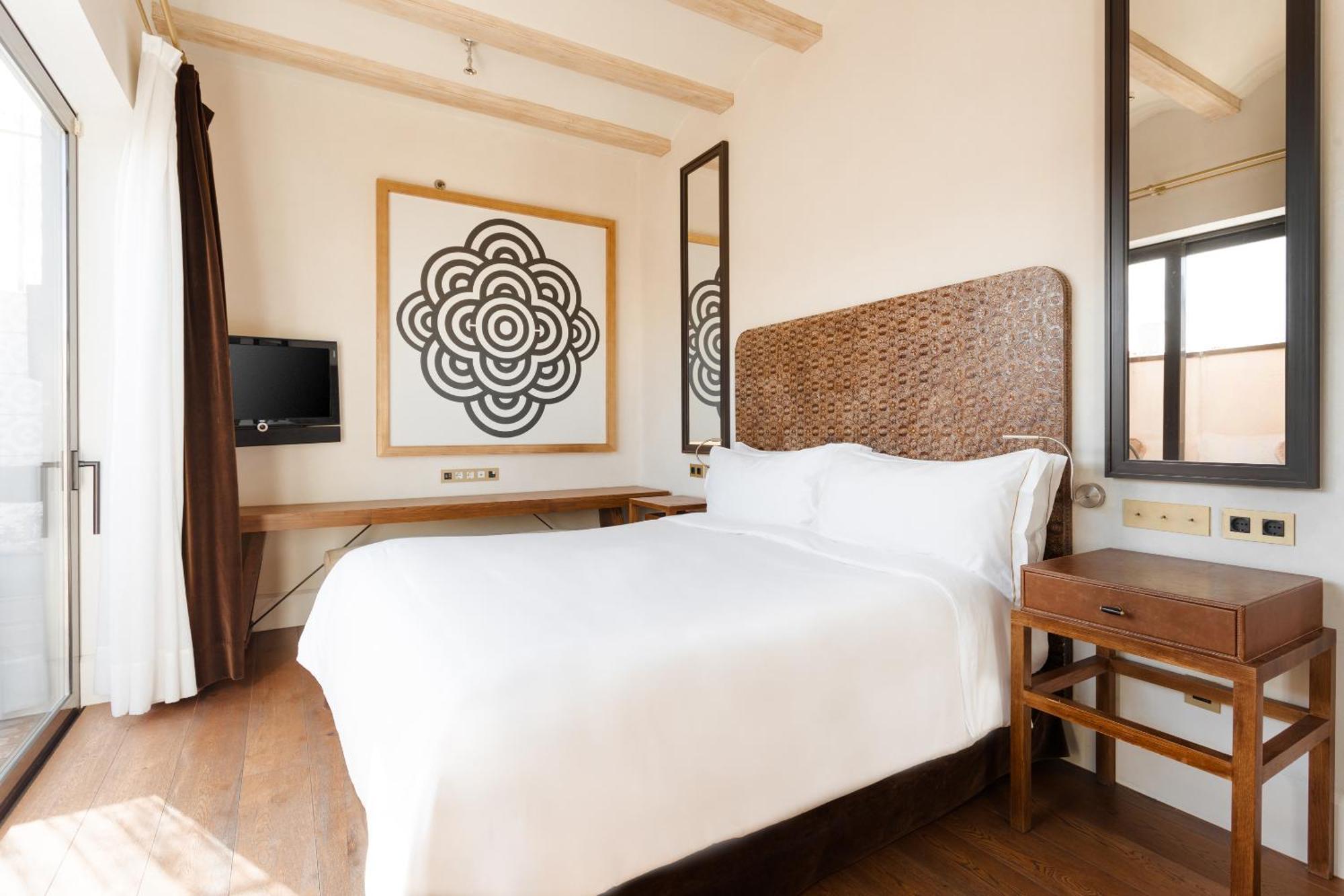 โรงแรมโดพลสคาเรียลจีแอล บาร์เซโลนา ห้อง รูปภาพ A bedroom at the hotel
